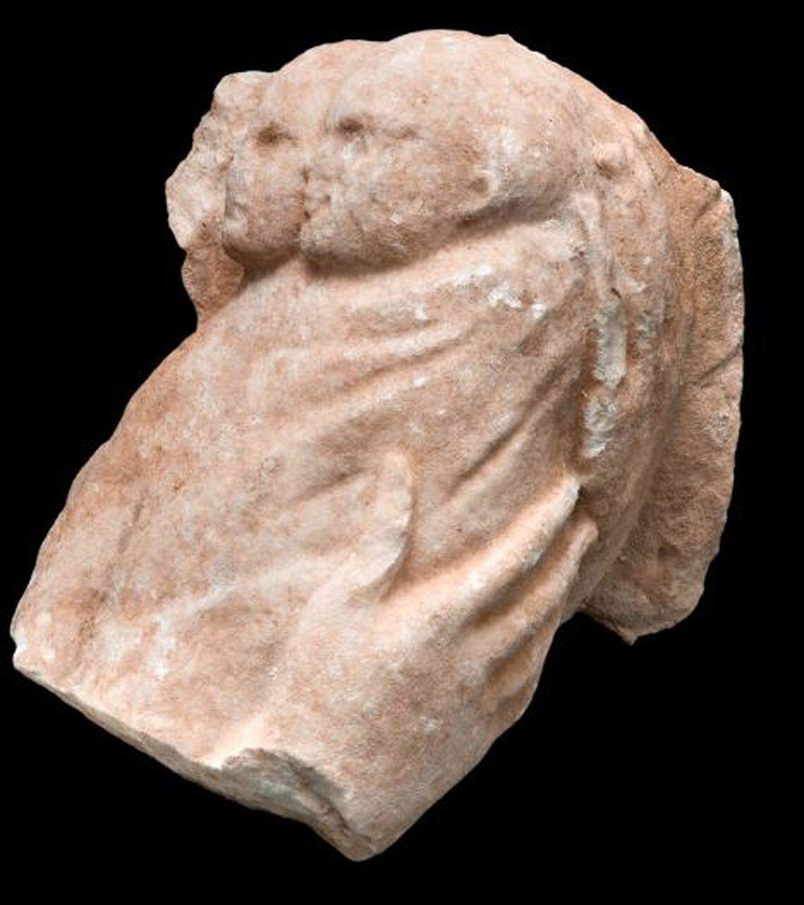 The marble carving depicted twin babies wrapped in the arms of their mother, archaeologists said.