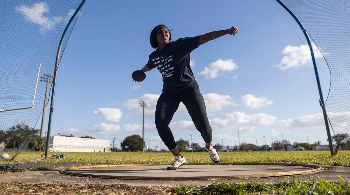 Jaiya Burchell, 18, a member of the Miami Northwestern Senior High track and field team, practices her discus throw at her school on Wednesday, Feb. 8, 2023, in Miami, Fla.