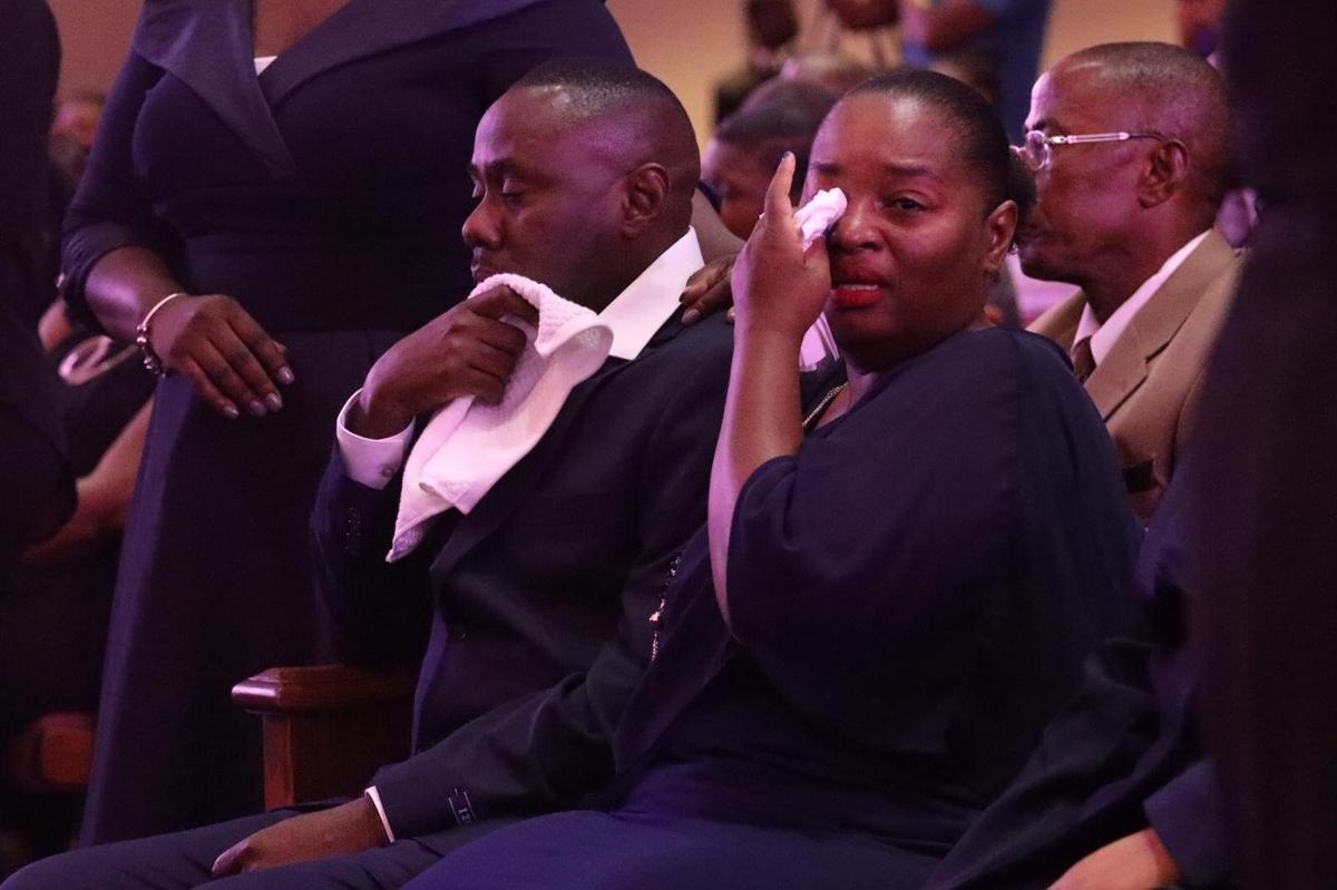 Florence Dennis (right) and Antonio Dumay, father of Richecarde Dumay, mourn during the memorial service at 93rd Community Baptist Church on Saturday, June 22, 2019, for the teen and the two of his teammates killed by a motorist.