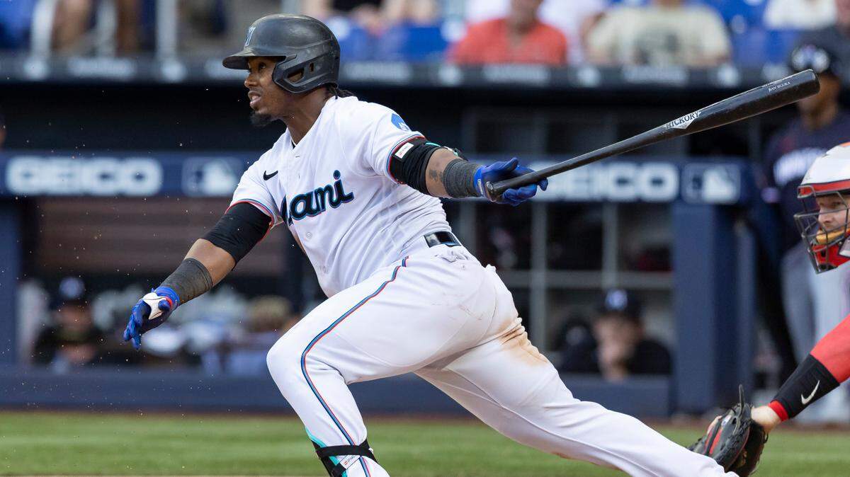 Miami Marlins third baseman Jean Segura (9) singles on a ground ball against the Minnesota Twins during the eighth inning of an MLB game at loanDepot park on Wednesday, April 5, 2023, in Miami, Fla.