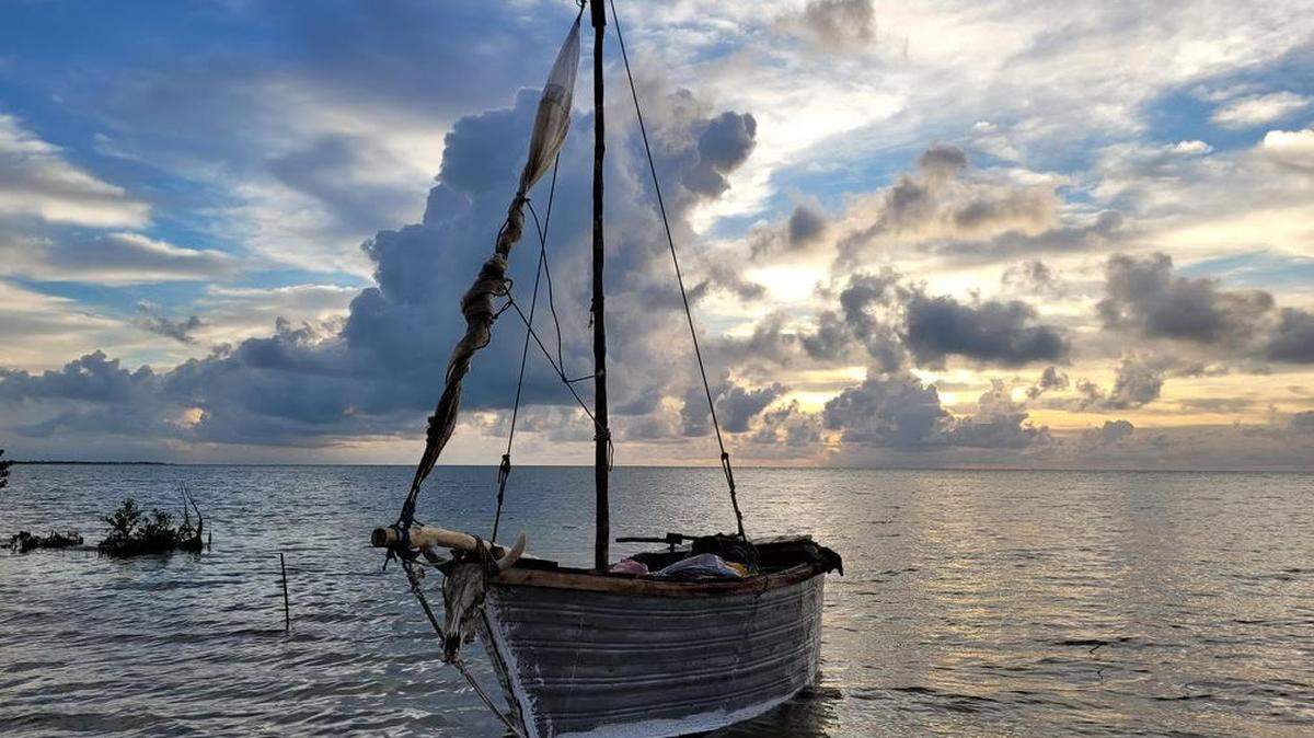 A small sailboat floats offshore of Grassy Key Thursday, Nov. 4, 2022. The vessel was used by 22 people to sail from Cuba to the Florida Keys, according to the Border Patrol.