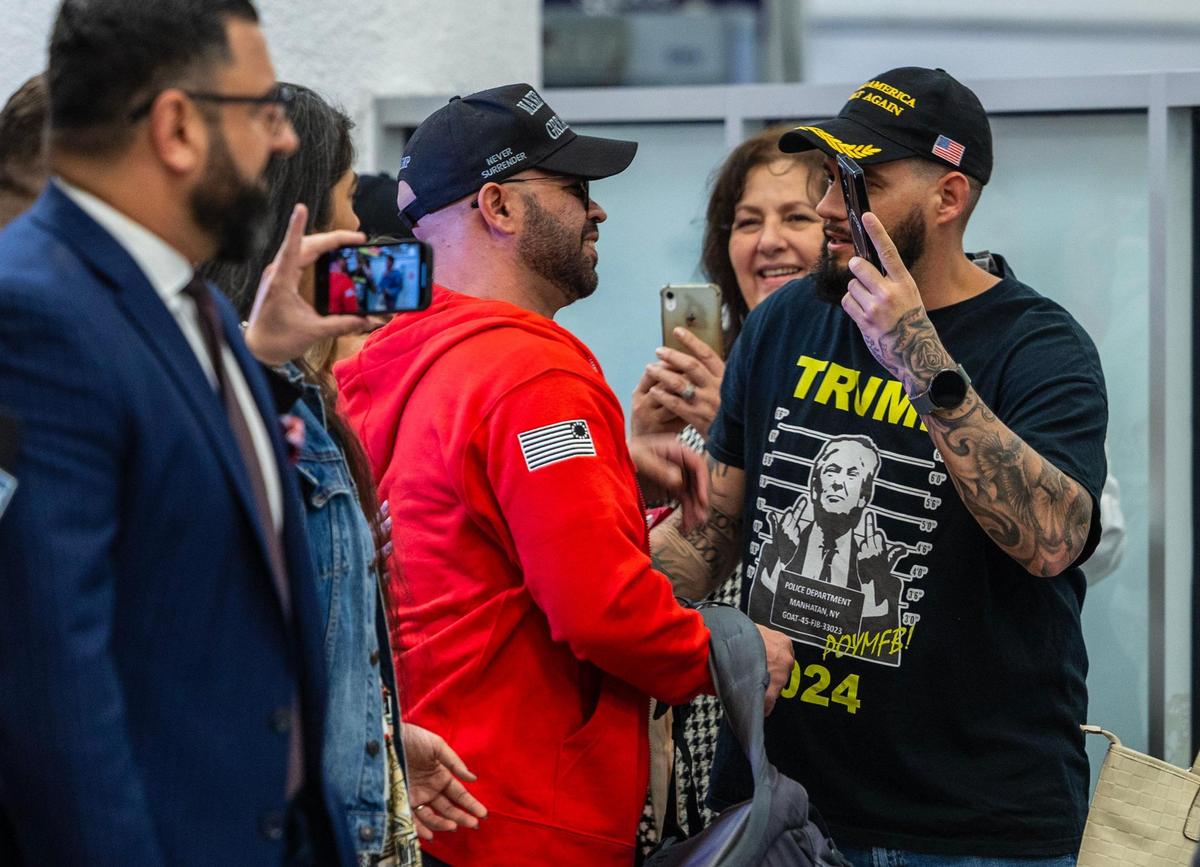 Gabriel Garcia (far right), a former Miami Proud Boy, was among family members and supporters who welcomed Proud Boys Chair Enrique Tarrio (center), as he arrives at Miami International Airport on Wednesday, Jan. 22, 2025. Tarrio was released from federal prison after Trump pardoned him Monday for his role in orchestrating the Jan. 6, 2021, attack on the U.S. Capitol.