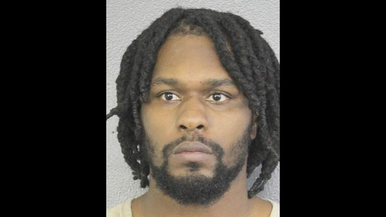 An NFL player is accused of being naked and fighting a cop near a South Florida daycare