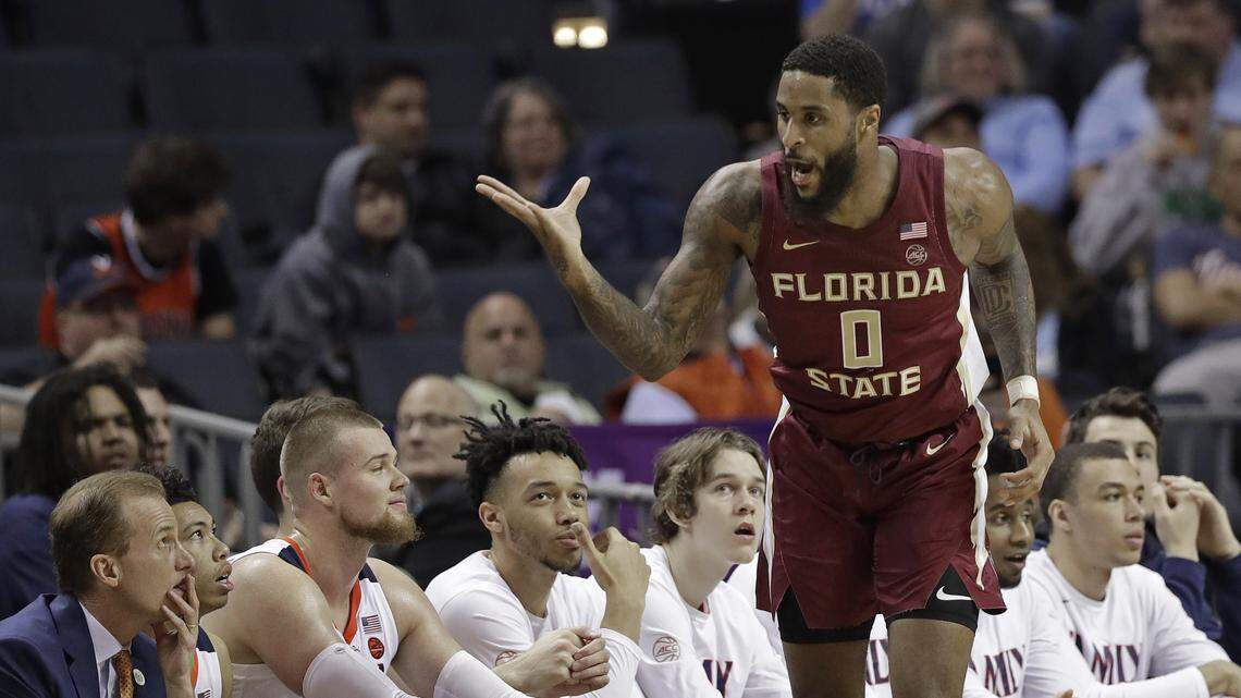 Florida State’s Phil Cofer (0) gestures toward the Virginia bench after making a basket during the first half of an NCAA college basketball game in the Atlantic Coast Conference tournament in Charlotte, N.C., Friday, March 15, 2019.