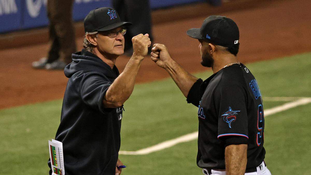 Miami Marlins manager Don Mattingly (8) and celebrate their 4-3 win over the the Atlanta Braves during a baseball game at loanDepot park on Friday, June 11, 2021 in Miami, Florida.