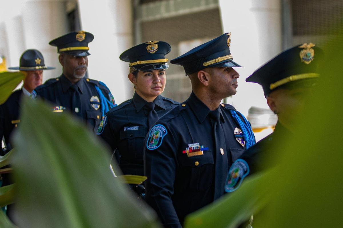 Police officers and other law enforcement members line up in a procession before fallen Officer Cesar “Echy” Echaverry’s memorial service at loanDepot park in Miami, Florida, on Wednesday, Aug. 24, 2022.