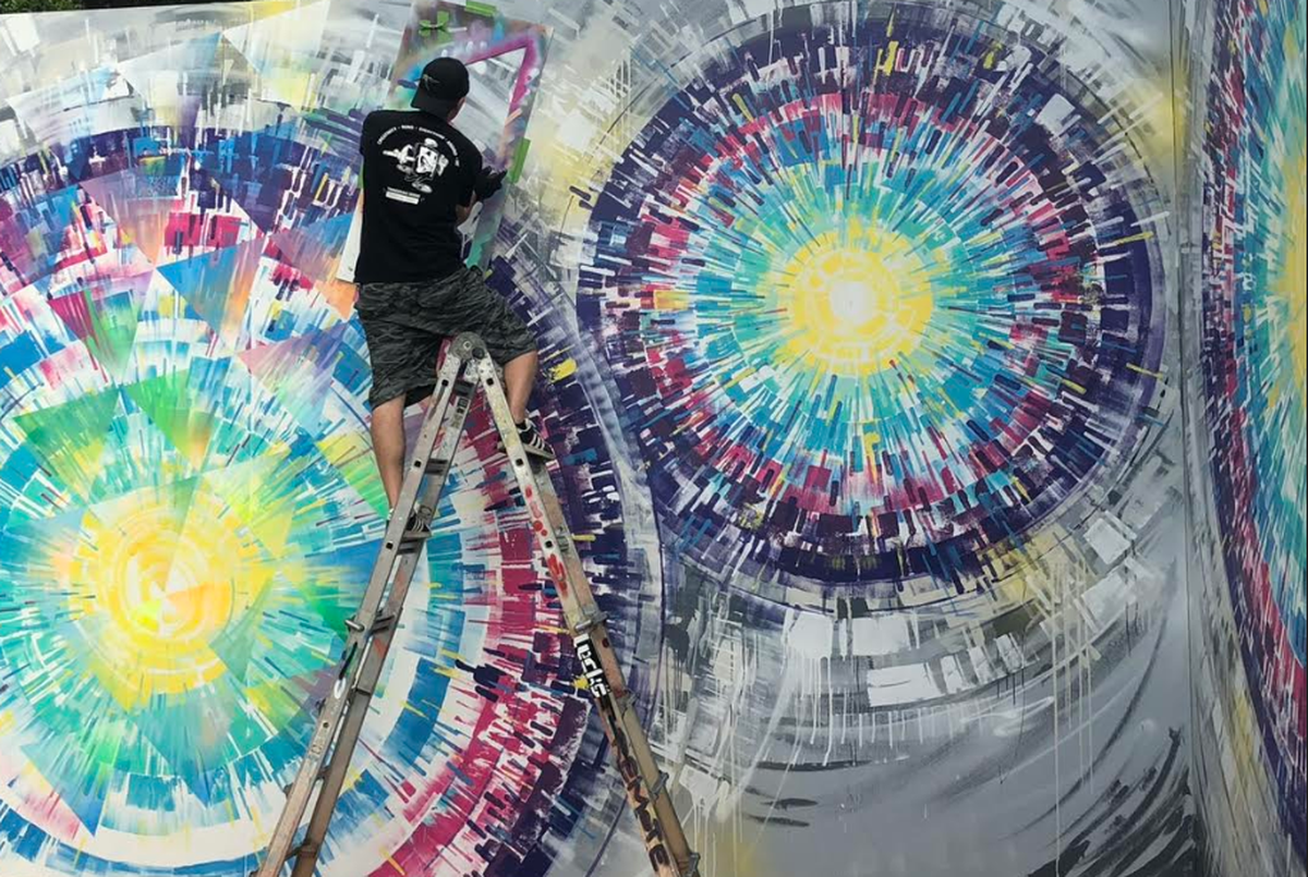 Wynwood’s own artist Jay Bellicchi works on his work called “Sacred Street Geometry” at Hard Rock Stadium