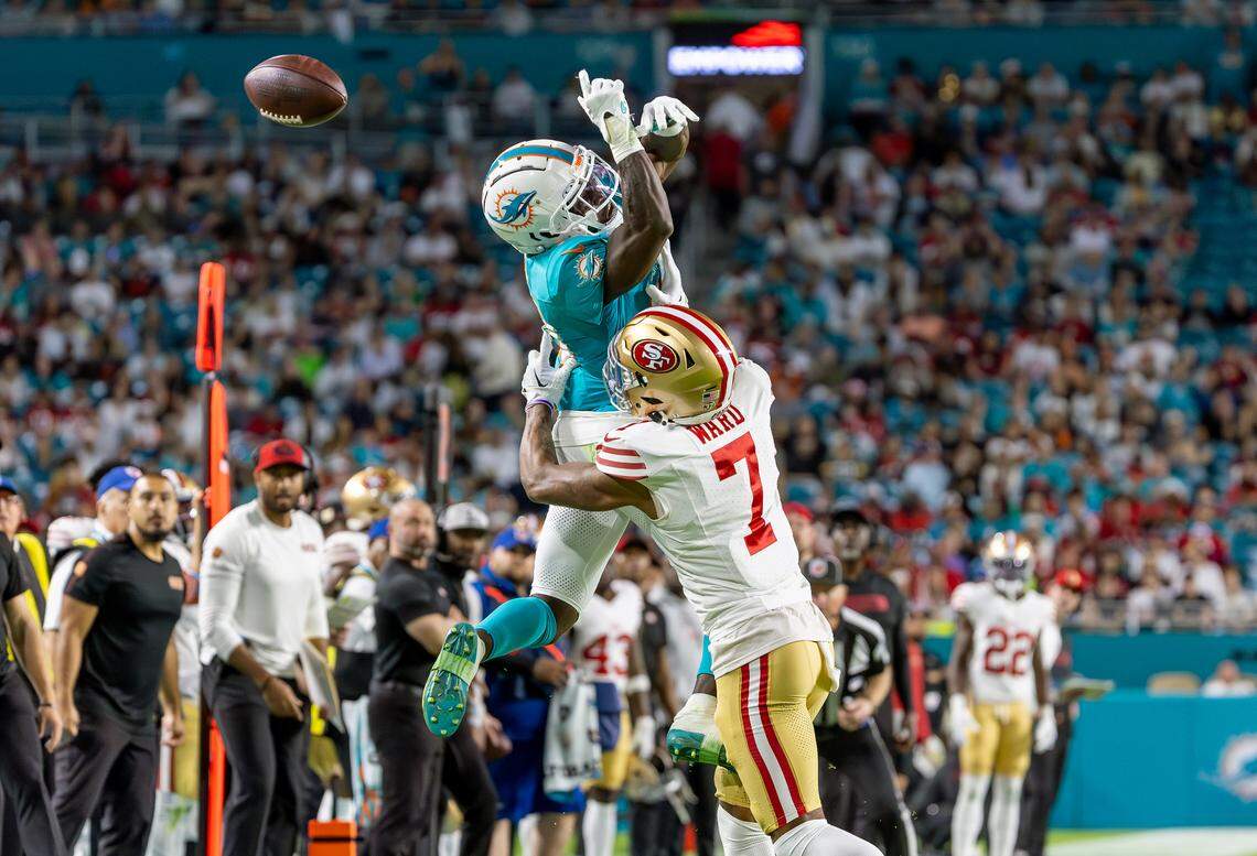 Miami Dolphins wide receiver Tyreek Hill (10) fails to catch a pass as San Francisco 49ers cornerback Charvarius Ward (7) defends during a timeout in the second half of an NFL game at Hard Rock Stadium on Sunday, December 22, 2024, in Miami Gardens, Florida.