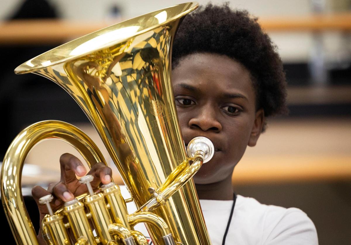 Anton Mole, seventh grader, plays the baritone horn during the Achieve Miami afterschool program, a free music program for kids, on Wednesday, Oct. 18, 2023, at Caribbean K-8 Center in Miami.