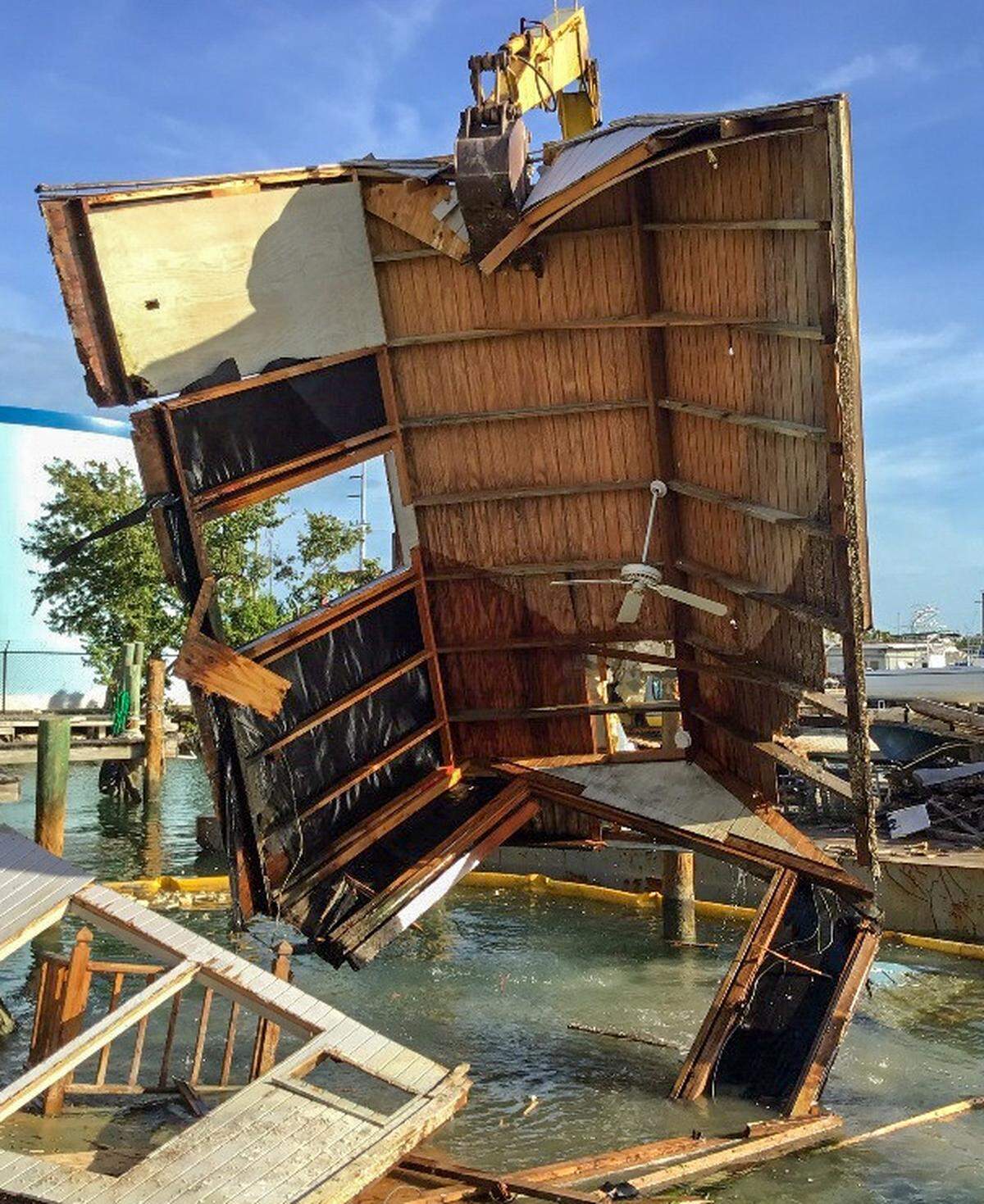 Crews remove debris from a Marathon canal. The Keys-wide project is halfway done.