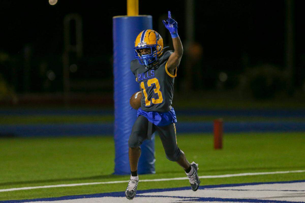 Northwestern Bulls Cornell Mims (13) scores touchdown during the fourth quarter of a high school football game against the Jackson Generals at Traz Powell Stadium in Miami, Florida, on Friday, September 1, 2022.