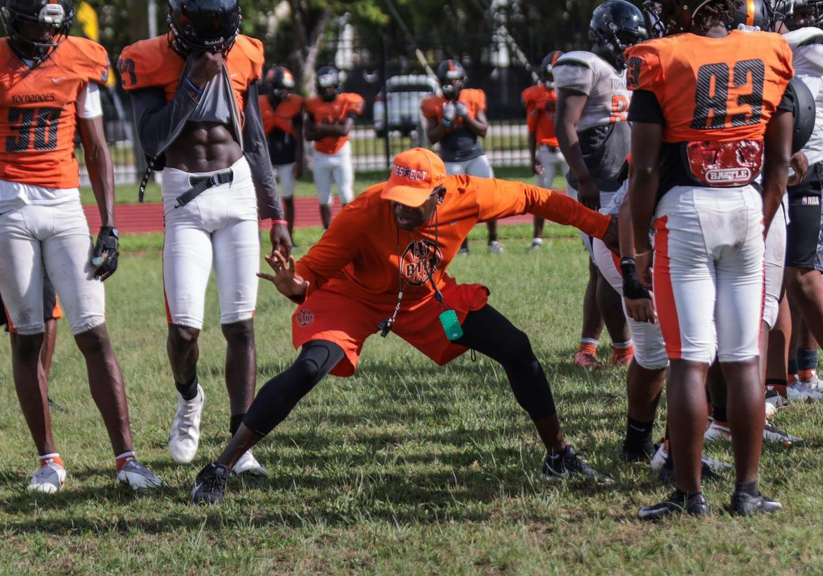 On Monday, August 8, 2022 Booker T. head football coach Tim “Ice” Harris, center, holds practice at Booker T. Washington High School in Miami, Florida.