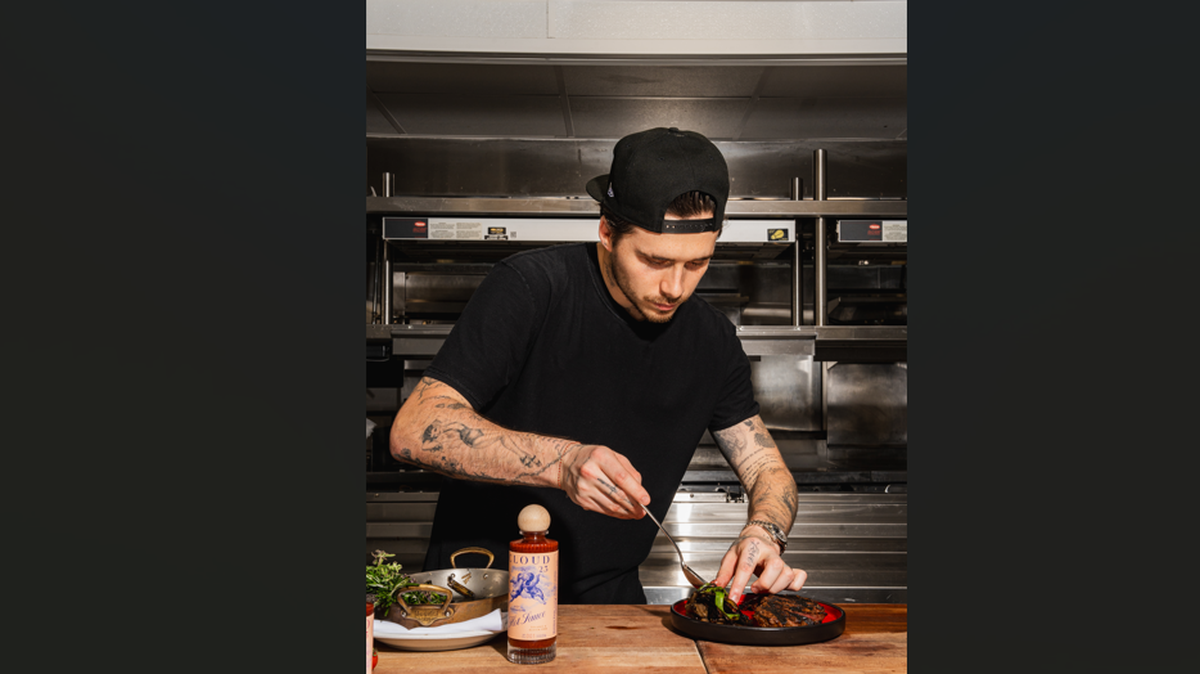 Brooklyn Beckham in the kitchen at Komodo Miami