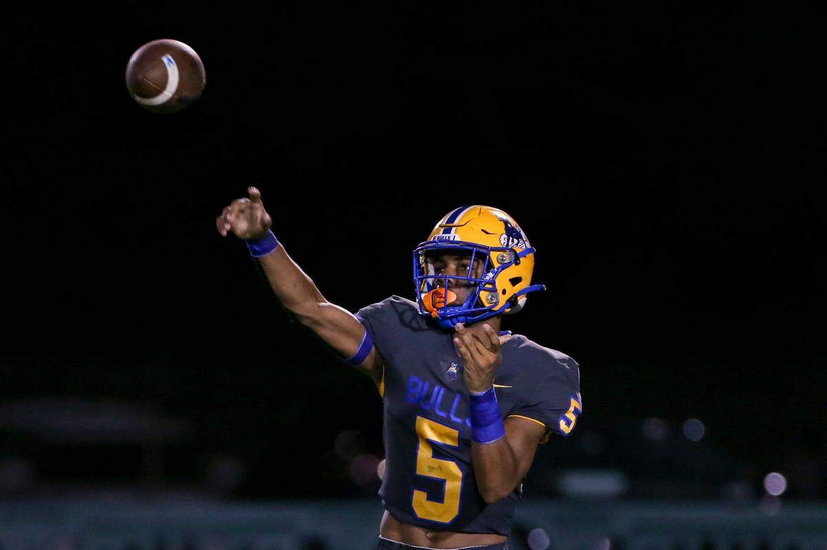 Northwestern Bulls quarterback Taron Dickens (5) throws the football during the first quarter of a high school football game against the Jackson Generals at Traz Powell Stadium in Miami, Florida, on Friday, September 1, 2022.
