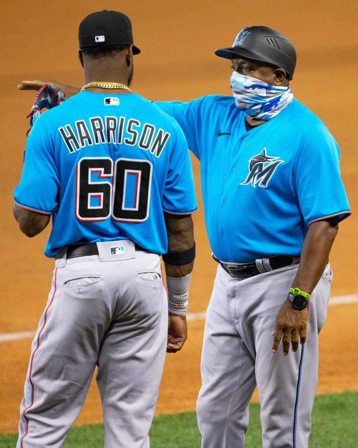 Marlins first base coach Billy Hatcher speaks with outfielder Monte Harrison during a intra squad simulated game at Marlins Park in Miami, Florida on Tuesday, July 14, 2020.