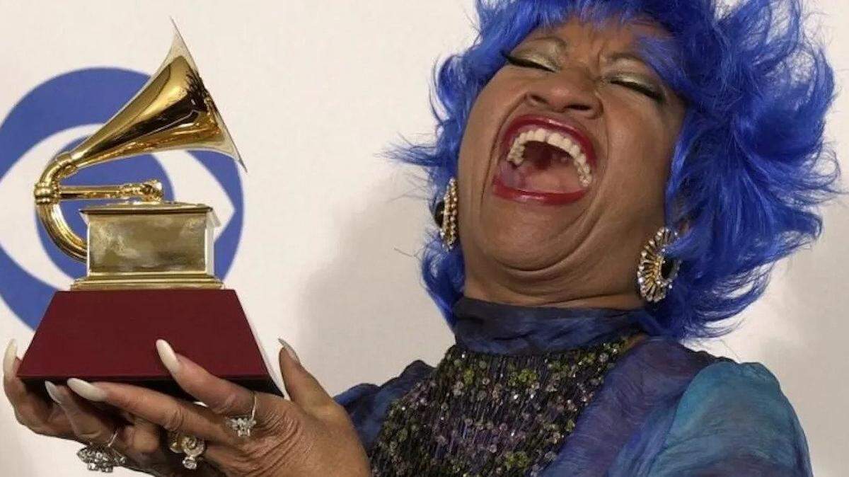 Salsa singer Celiz Cruz exults over one for the four Grammy Awards she won during her career.