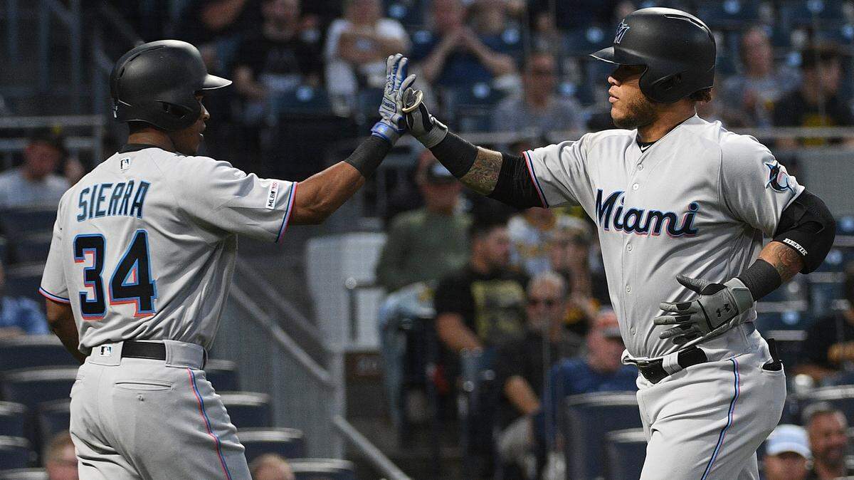 The Miami Marlins’ Harold Ramirez celebrates with Magneuris Sierra after hitting a home run in the second inning during the game against the Pittsburgh Pirates at PNC Park on September 5, 2019 in Pittsburgh, Pennsylvania.