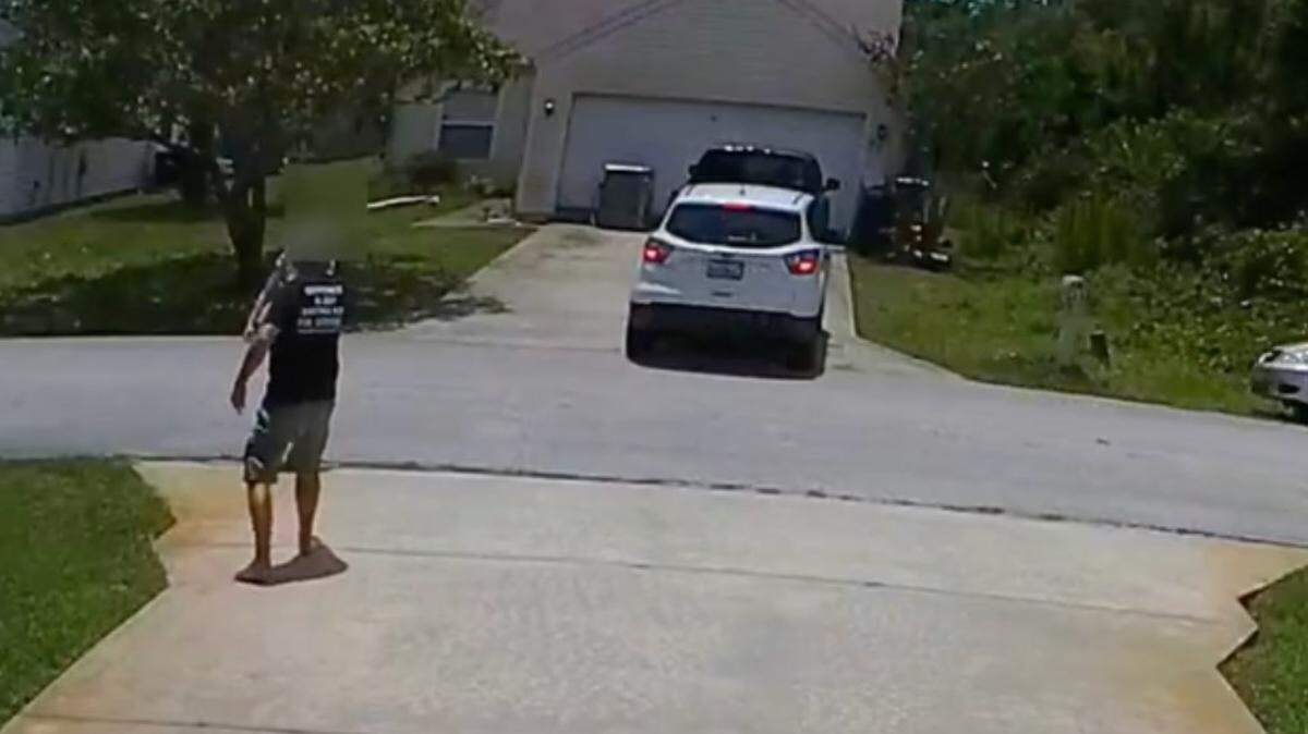A Florida man was arrested, accused of pointing a handgun at a woman’s head and threatening to kill her after her friend backed up into the man’s driveway, according to the Flagler County Sheriff’s Office, which was provided surveillance video of the incident.