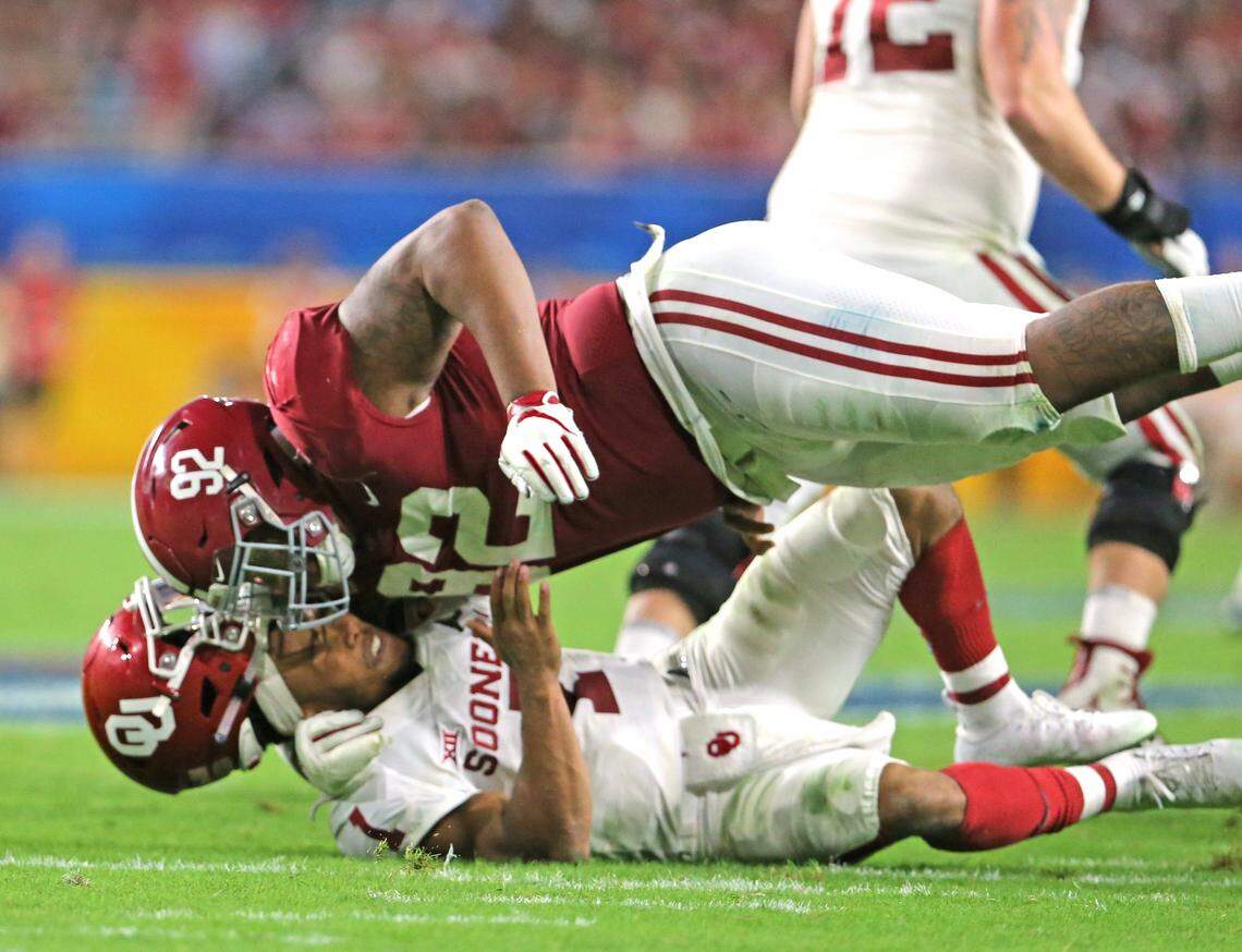 Alabama Crimson Tide offensive linemen Quinnen Williams (92) tackles Oklahoma Sooners quarterback Kyler Murray (1) during fourth quarter of the College Football Playoff Semifinal at the Orange Bowl game at Hard Rock Stadium on Saturday, December 29 2018, in Miami Gardens.