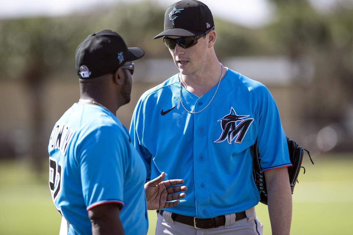 Miami Marlins third baseman Brian Anderson (15) at right, speaks with bench coach James Rowson during Miami Marlins spring training at the Roger Dean Chevrolet Stadium in Jupiter on Tuesday, February 18, 2020.