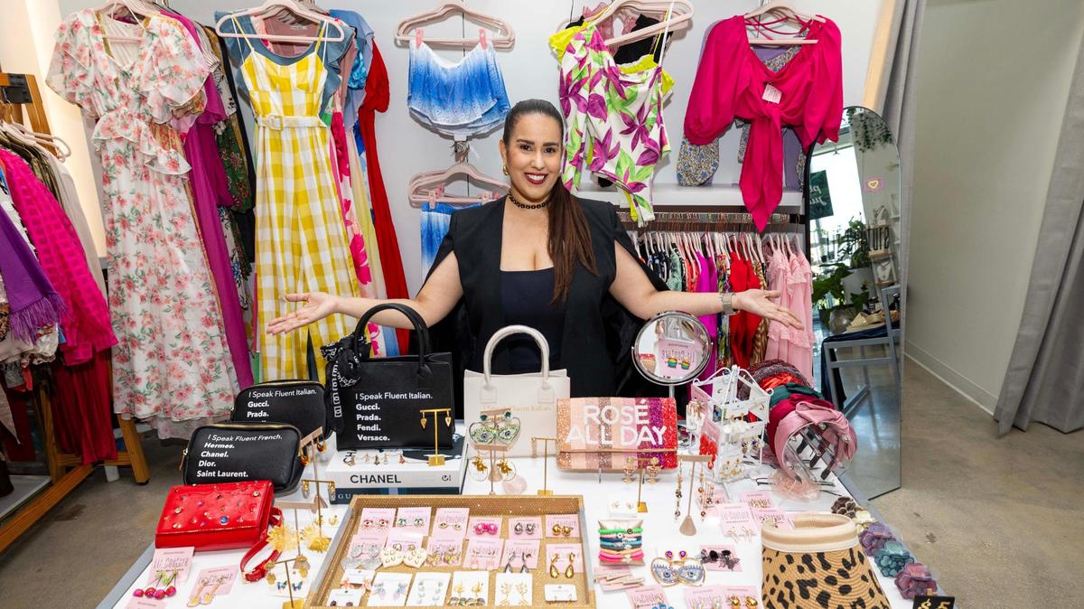 Liz Ceballos stands by items for sale at Liz-Couture inside Capsule on Wednesday, June 18, 2025, in Miami.