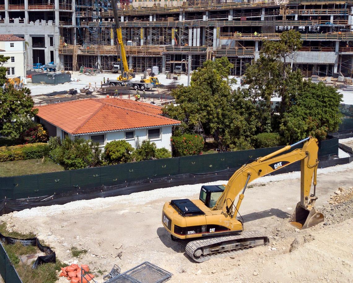 The home of Orlando Capote, 63, and his mother Lucia Capote, 90, surrounded by construction. The family refused to sell to developers of the Plaza at Coral Gables, a complex with condos, shops, and the Loews Hotel. Everybody else on the street sold their houses, which were torn down. Construction crews are building around them on Tuesday, March 12, 2019.