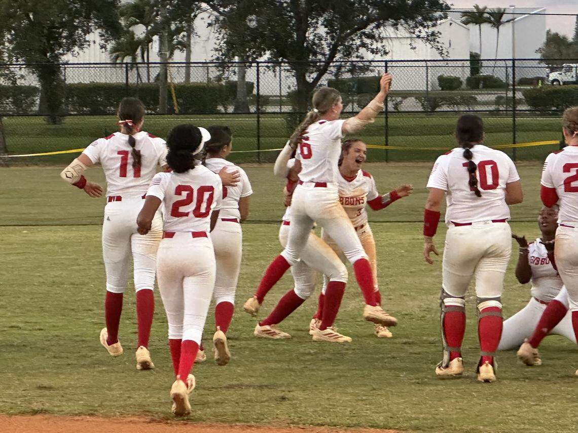Cardinal Gibbons softball players run into the outfield at Pompano Four Fields Park after winning their first BCAA Big 8 championship on Wednesday following a 1-0 win over Coral Springs Charter.