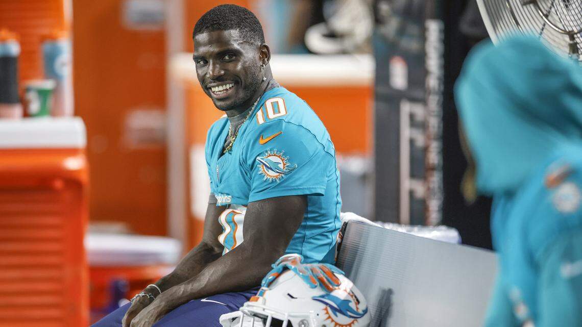 Miami Dolphins wide receiver Tyreek Hill (10) on the bench during an NFL football game against the Jacksonville Jaguars at Hard Rock Stadium in Miami Gardens, Florida, on Saturday, August 23, 2025.