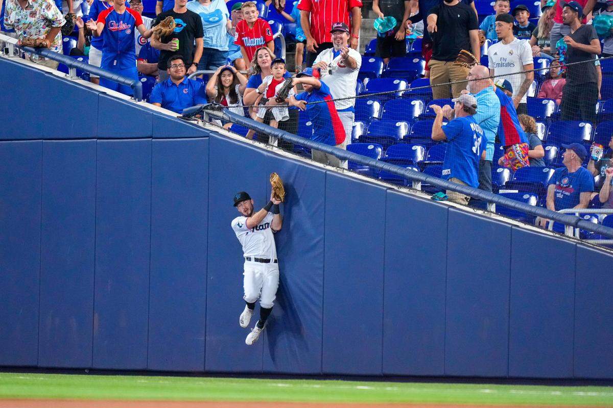 Apr 30, 2023; Miami, Florida, USA; Miami Marlins shortstop Garrett Hampson (1) attempts to catch against the Chicago Cubs during the first inning at loanDepot Park. Mandatory Credit: Rich Storry-USA TODAY Sports