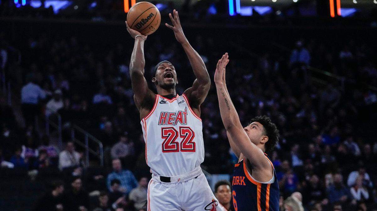 Miami Heat’s Jimmy Butler (22) shoots over New York Knicks’ Quentin Grimes (6) during the first half of an NBA basketball game, Thursday, Feb. 2, 2023, in New York.