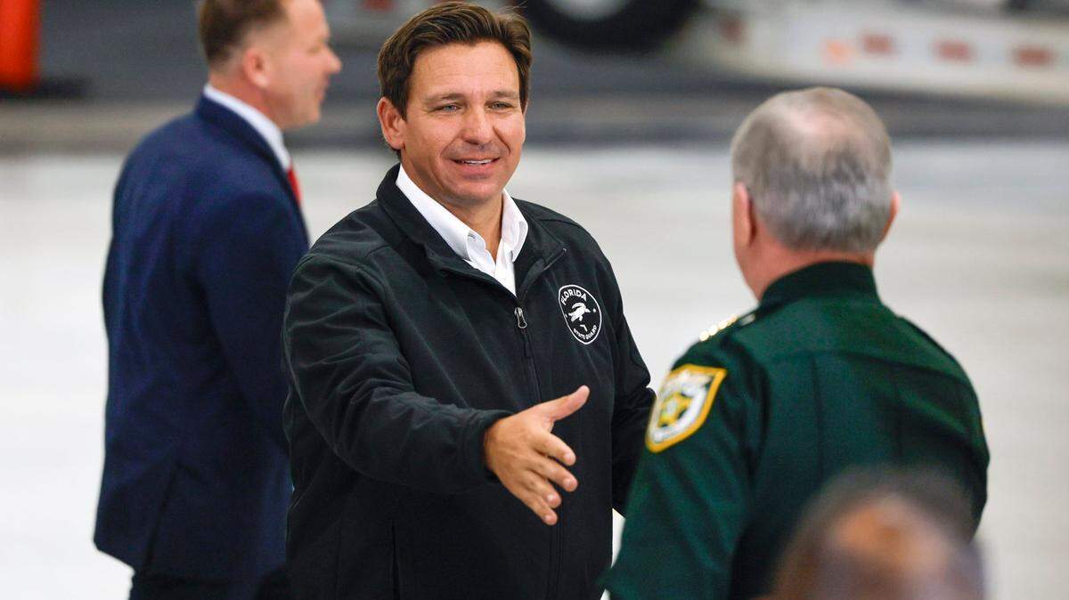 Florida Governor Ron DeSantis departs a press conference at the Homestead Air Force Base alongside Department of Homeland Security Senior Counselor Keith Pearson in Homestead, Florida on Wednesday, February 26, 2025.