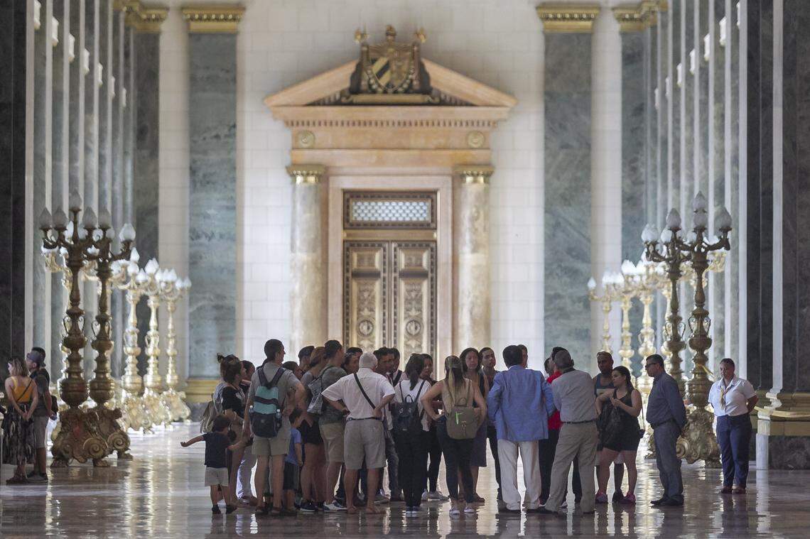 A group of tourists visits the newly refurbished Capitol building in Havana.