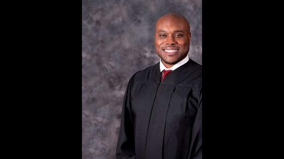 Who is Andrew Bain? He’s been a judge, UM football player and wannabe marine biologist
