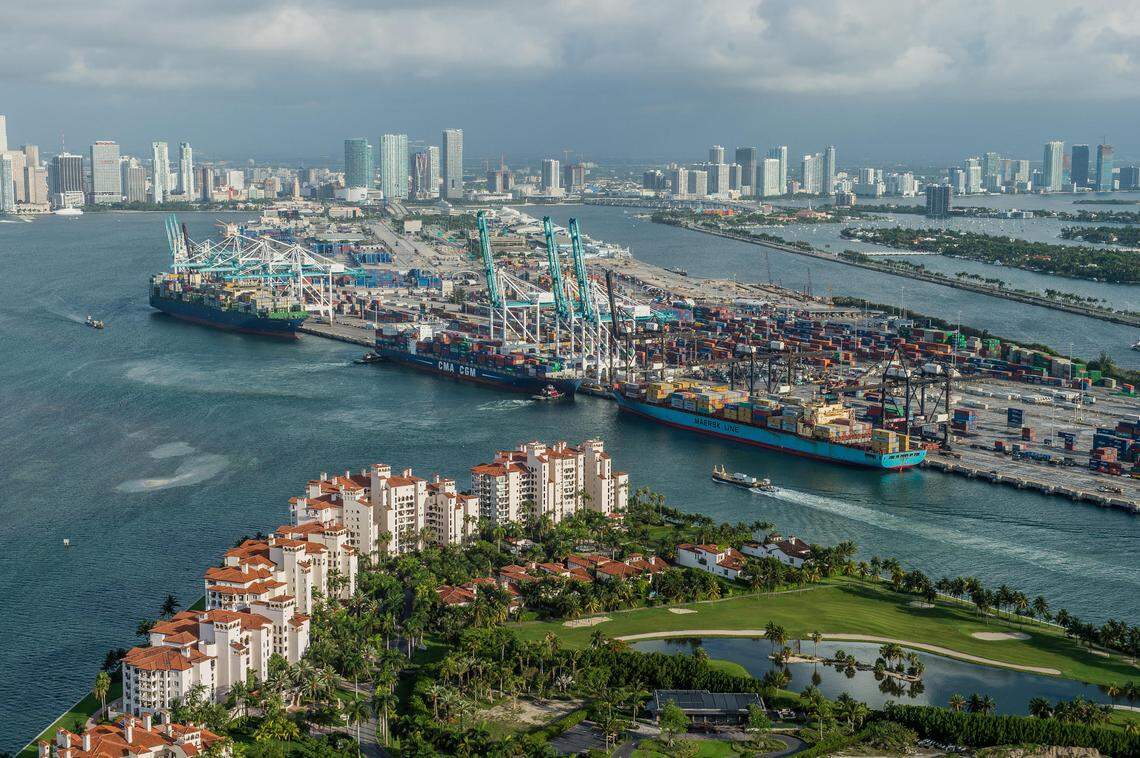An aerial view of PortMiami, a county-owned facility that sits on land once owned by Miami, with Fisher Island in the foreground.