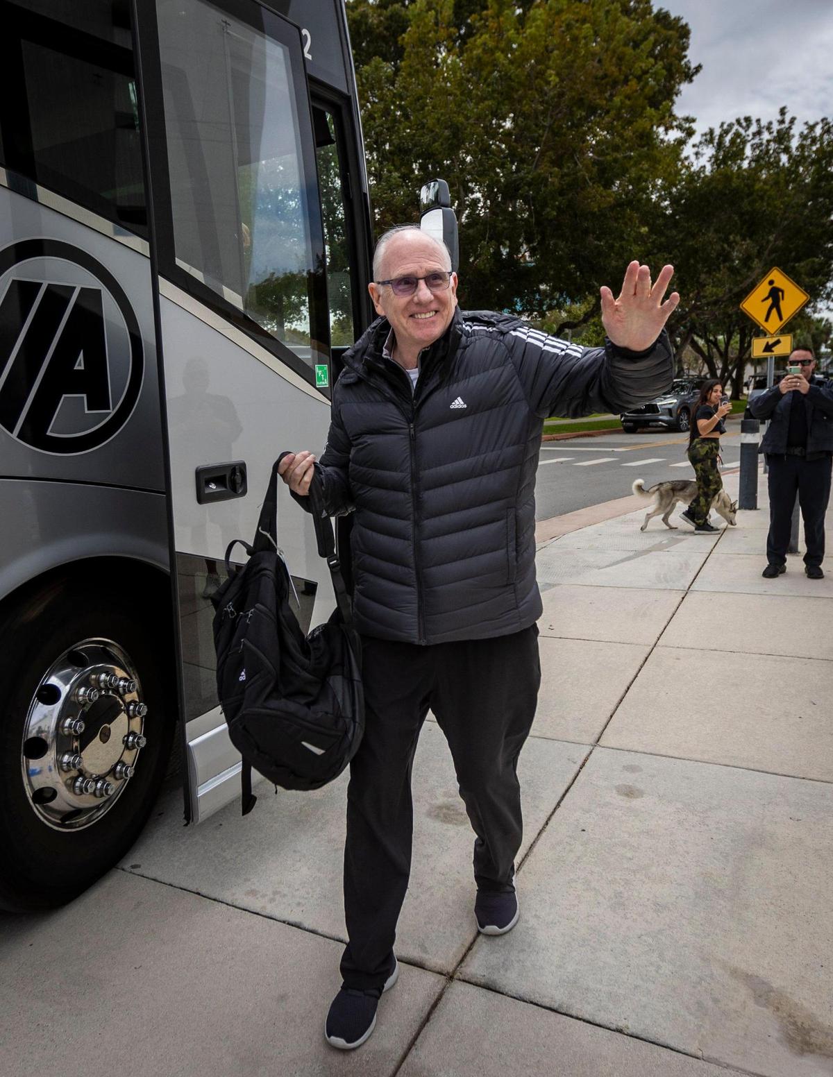 Miami, FL- March 19, 2023 - University of Miami Head Coach Jim Larrañaga waves at UM fans at the Watsco Center at the University of Miami. The team arrived home this afternoon after qualifying for the Sweet 16 in the NCAA Tournament.