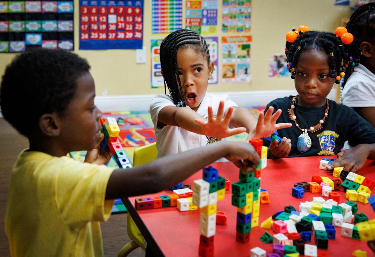Maliyah, center, plays with other kids in the voluntary pre-kindergarten program during the afternoon on Wednesday, Nov. 13, 2024, at Liberty Academy, a school and aftercare facility in Liberty City.