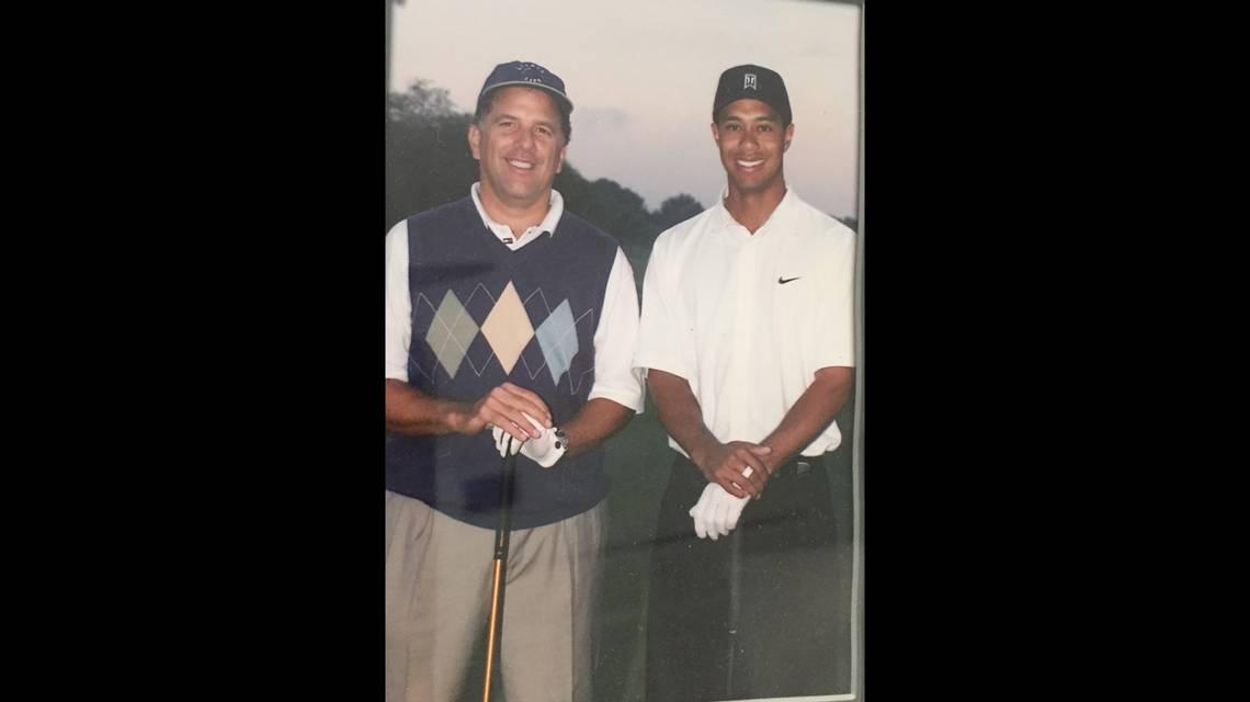 Andrew Kowalczyk, left, with Tiger Woods.