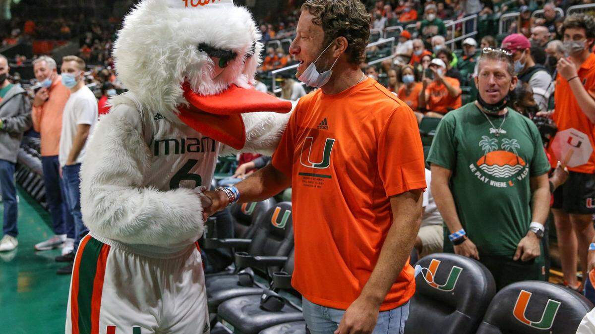 The Miami Hurricanes Ibis greets Barstool Sports founder Dave Portnoy before the start of the game against Florida State Seminoles at the Watsco Center in Coral Gables on Saturday, January 22, 2022.