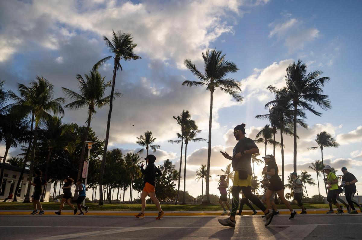 Runners make their way up Ocean Drive in Miami Beach during the Life Time Miami Marathon and Half Marathon on Sunday, Jan. 29, 2023.