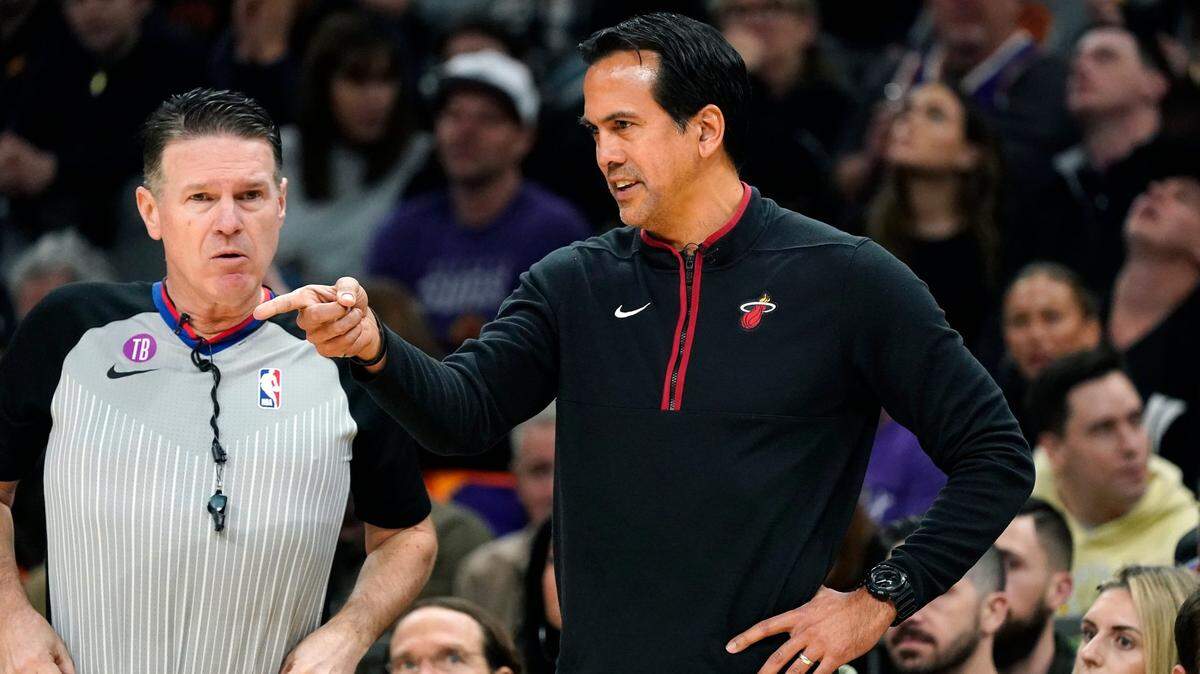 Miami Heat head coach Erik Spoelstra, right, argues with referee Pat Fraher, left, during the first half of an NBA basketball game against the Phoenix Suns in Phoenix, Friday, Jan. 6, 2023.