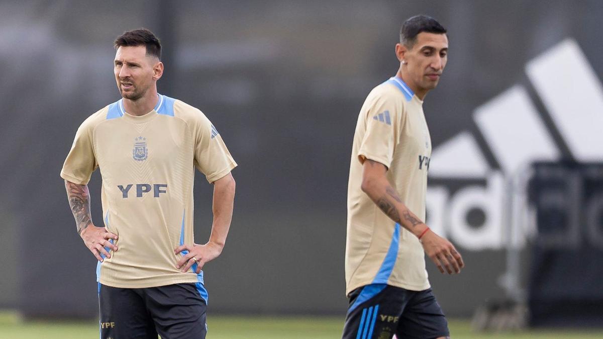 Argentina’s forward Lionel Messi, left, and midfielder Ángel Di María look on as team practice gets underway at the Florida Blue Training Center in Fort Lauderdale, Fla.