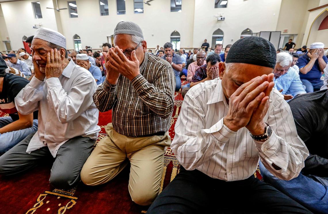 Men gather to pray at the Islamic Center of Greater Miami in Miami Gardens on Friday.