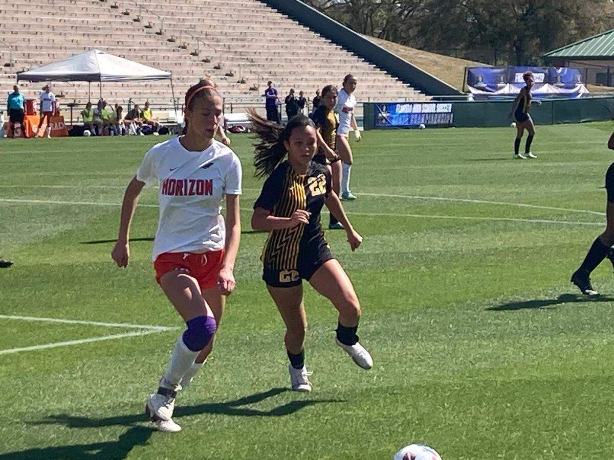American Heritage’s Allison Aleman and Horizon’s Lily Dobson chase a loose ball during Tuesday’s Class 5A state semifinal at Spec Martin Stadium in DeLand, Fla.