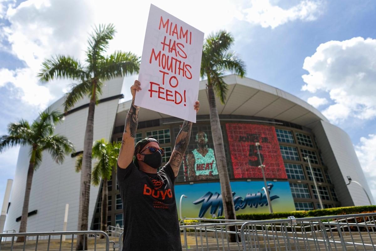 Jeff Grosser, 41, owner of Buya Izakaya, attends a rally in front of AmericanAirlines Arena in downtown Miami on Friday, July 10, 2020, to protest Miami-Dade County Mayor Carlos Gimenez’s order to close inside dining at restaurants to avoid the spread of the coronavirus.