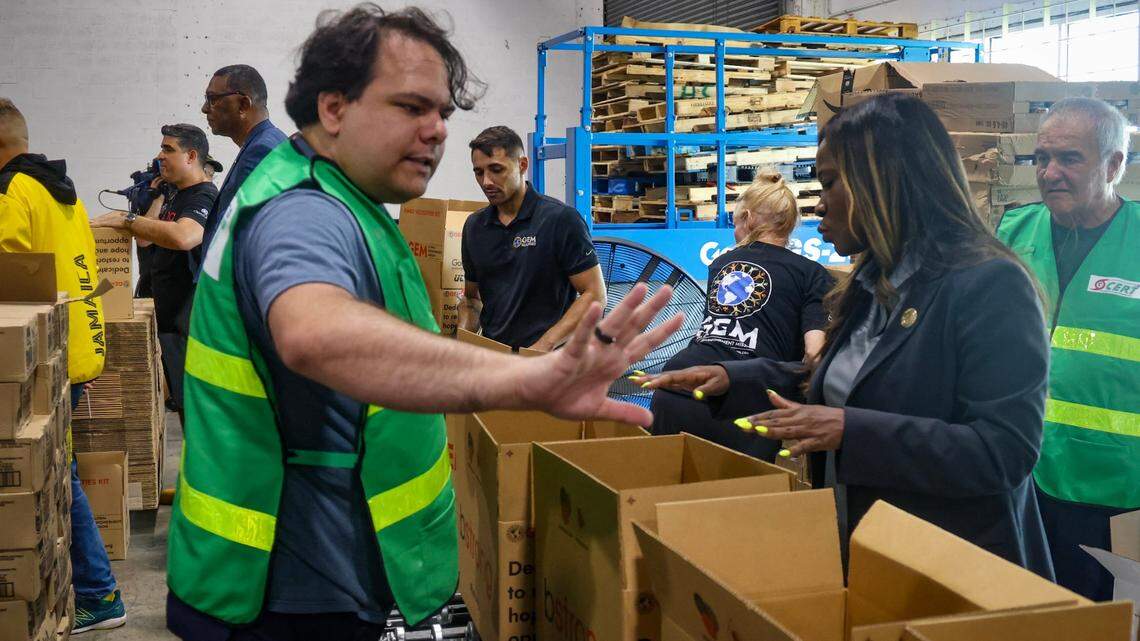 Volunteer Sergio Martinez, left, help in the coordination of packing hurricane recovery kits as volunteers participate in Aid Efforts to the Caribbean in conjunction with the Caribbean Consular Corps and SFL Caribbean Strong on Thursday, July 4, 2024 at the Global Empowerment Mission in Doral, Florida.