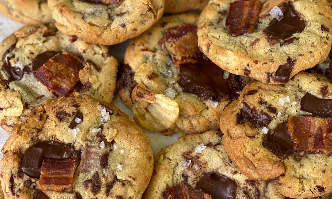 Master baker Hedy Goldsmith is baking cookies, like these candied bacon Junk in Da Trunk chocolate chip cookies, for delivery out of her home.