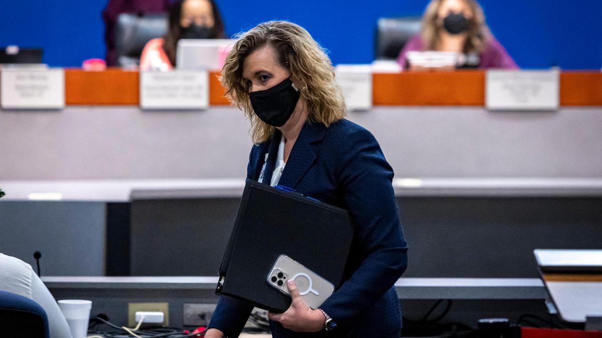 Dr. Vickie Cartwright walks out after answering questions from the Broward County School Board during a school board meeting to pick the next superintendent on Feb. 9, 2022.