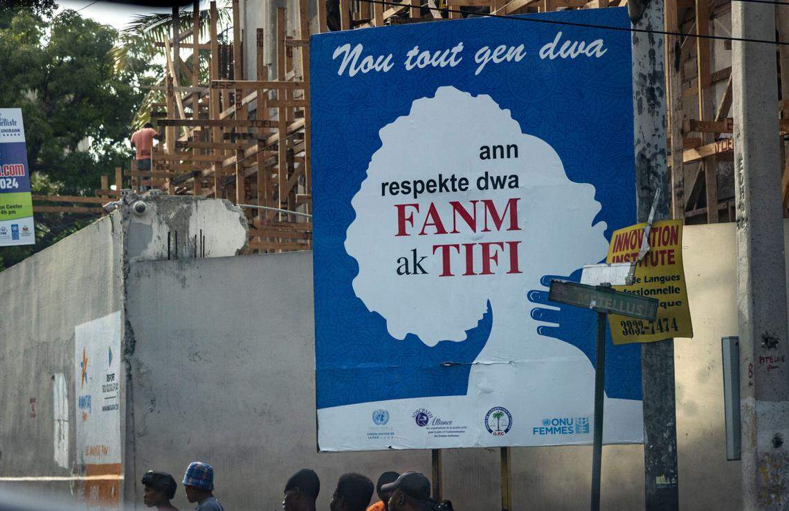 A rare anti-rape billboard on a street in Pétion-Ville, Haiti, demands that the rights of women and girls be respected.