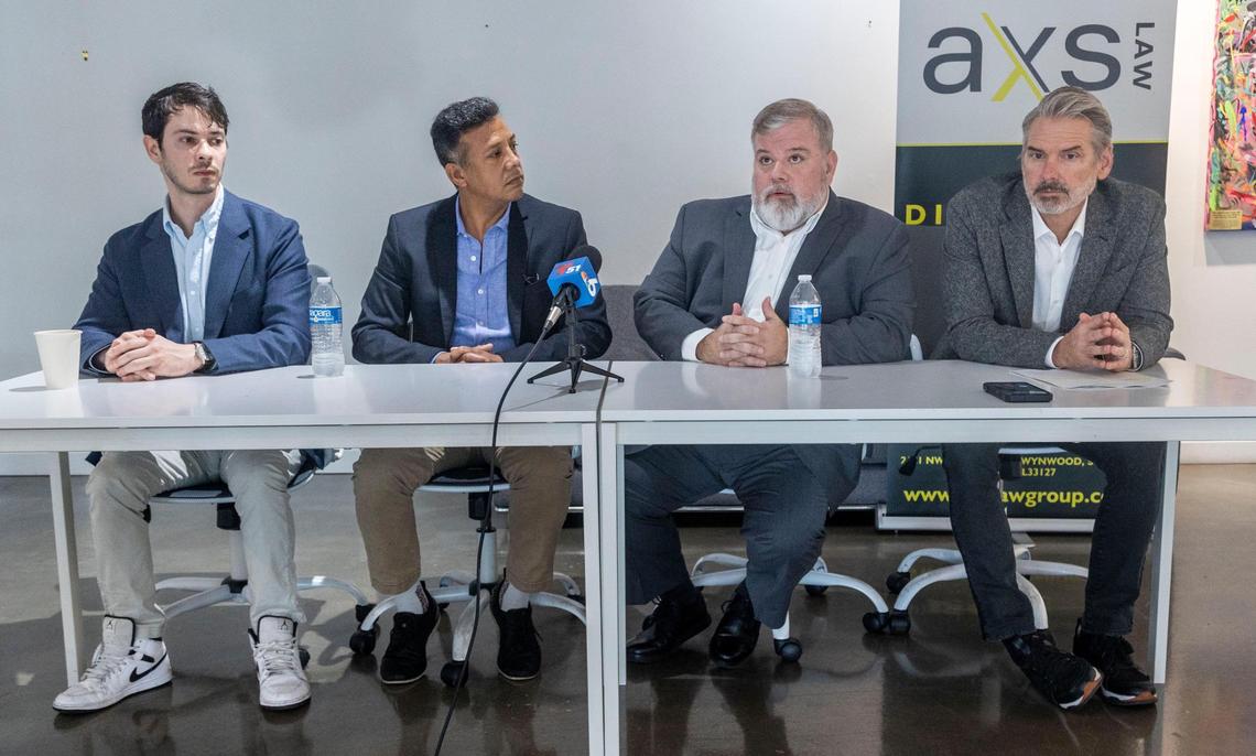 Jose Canto, second from left, former finance director of the Bayfront Park Management Trust, and Jose Suarez, second from right, former executive director of the Trust, speak during a press conference at AXS Law in Miami on Wednesday, Jan. 22, 2025. Attorney Sam Kramer is pictured on the left, and attorney Jeff Gutchess is on the right.