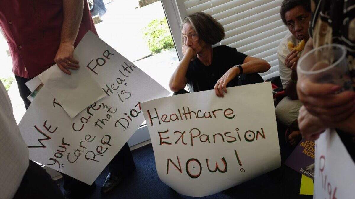 Activists occupy a Florida state House office in Miami, in support of an expansion of healthcare coverage.